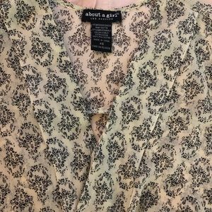 EUC Beautiful sheer wrap-style top.